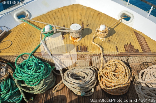 Image of Ropes on wooden ship deck