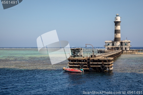 Image of Tall lighthouse on the sea