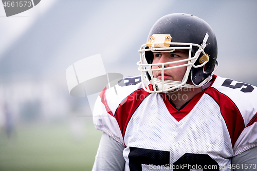 Image of portrait of young confident American football player