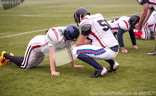 Image of professional american football players training