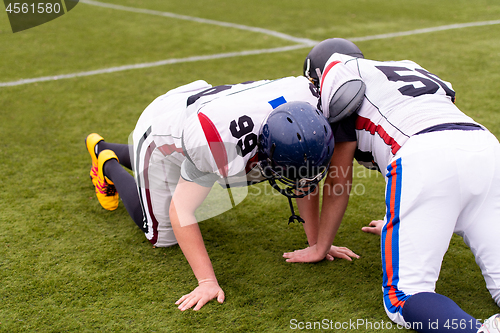 Image of professional american football players training