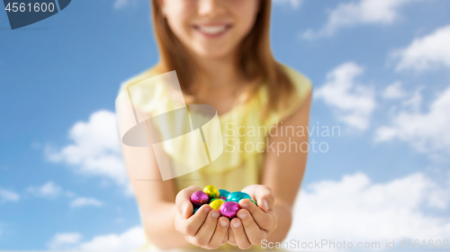 Image of close up of girl holding chocolate easter eggs