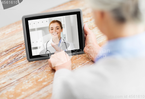 Image of senior woman patient having video call with doctor