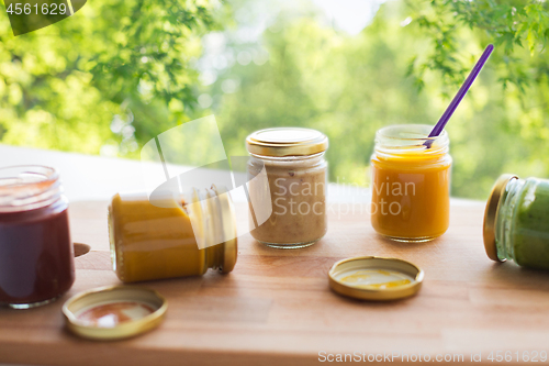 Image of vegetable or fruit puree or baby food in jars