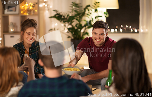 Image of friends drinking non-alcoholic beer at home