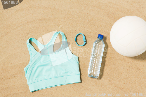 Image of sports top, ball, fitness tracker and water bottle