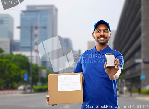 Image of indian delivery man with smartphone and parcel box