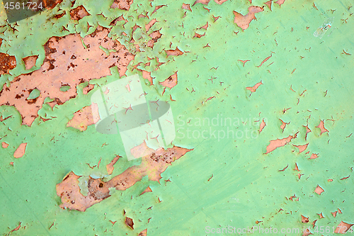 Image of Green metal texture with patches of rust steel on its surface, taken outdoor