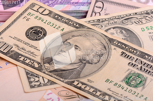 Image of US Dollars background with focus on Alexander Hamilton