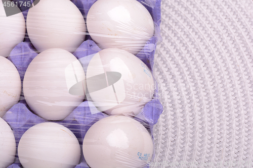 Image of Raw chicken eggs set on white background