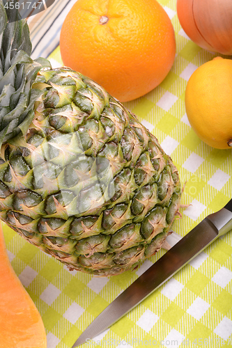 Image of collection of fruit and vegetables. Pineapple, lemon, grapefruit, pumpkin, orange