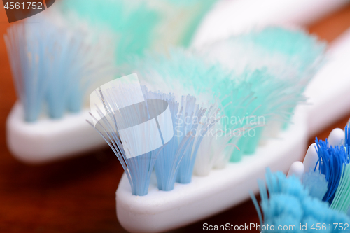 Image of xtreme Macro close up of toothbrush with wooden background