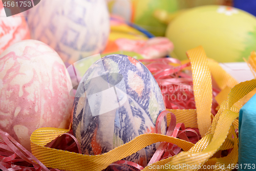 Image of Handcrafted easter eggs close up, ribbons and decoration