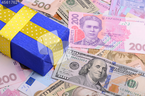 Image of banknotes, clear image of dollars and new bills Ukrainian national currency hryvnia with gift box