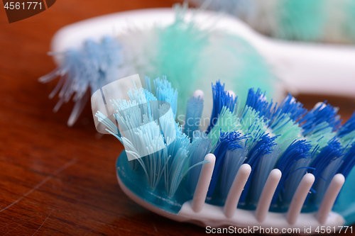 Image of xtreme Macro close up of toothbrush with wooden background