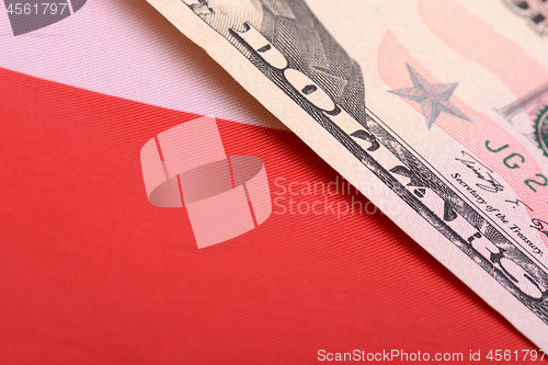 Image of fifty dollar bill in front of the American flag