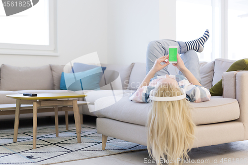 Image of girl enjoying music through headphones