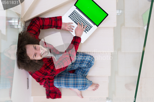 Image of freelancer in bathrobe working from home