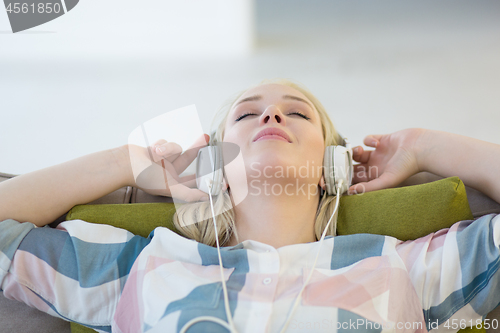 Image of girl enjoying music through headphones