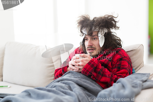 Image of young Man with flu and fever