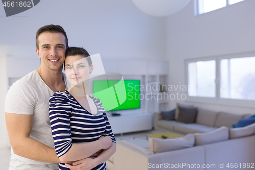 Image of couple hugging in their new home