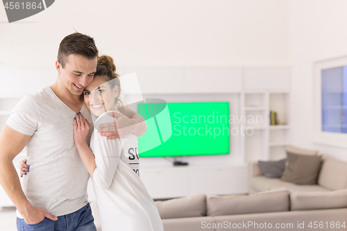 Image of couple hugging in their new home