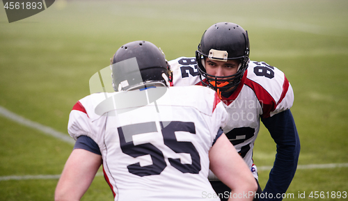 Image of professional american football players training