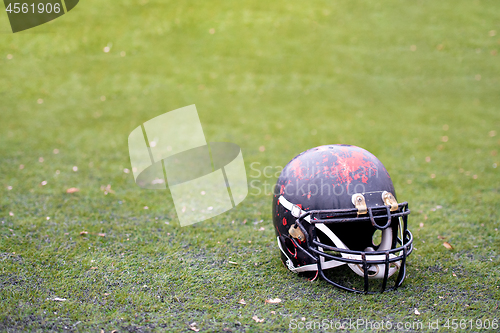 Image of black american football helmet