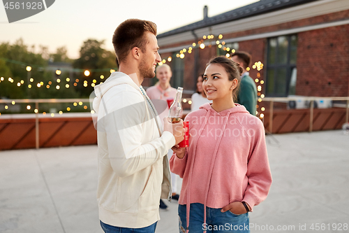 Image of friends with non alcoholic drinks at rooftop party