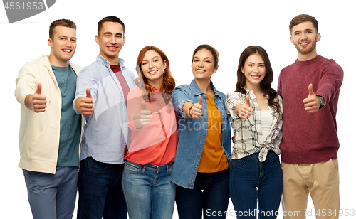 Image of group of smiling friends showing thumbs up