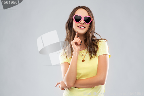 Image of teenage girl in heart-shaped sunglasses