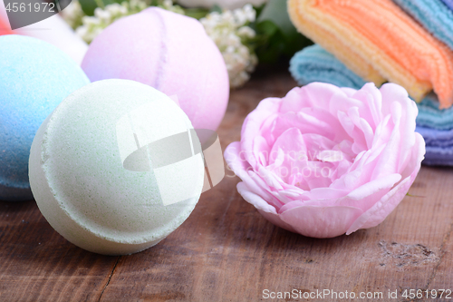 Image of towels set, aroma therapy, soap and sea salt on wooden plate