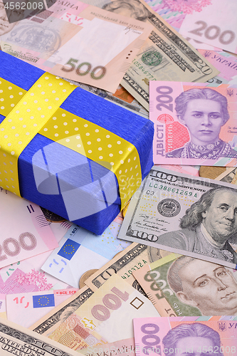 Image of banknotes, clear image of dollars and new bills Ukrainian national currency hryvnia with gift box