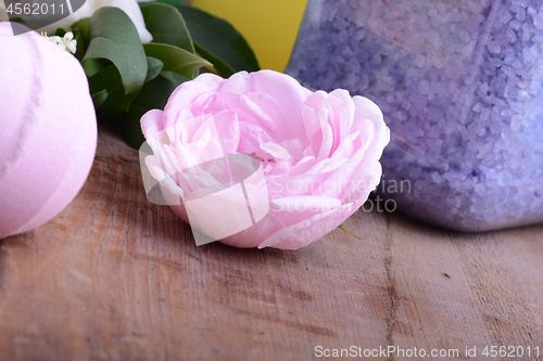 Image of aroma therapy, soap and sea salt on wooden plate