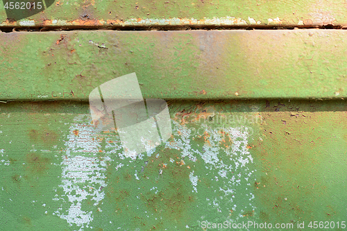 Image of Horizontal old green rusty metal door background