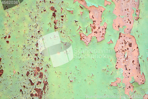 Image of Green metal texture with patches of rust steel on its surface, taken outdoor