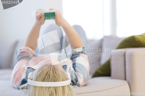 Image of girl enjoying music through headphones