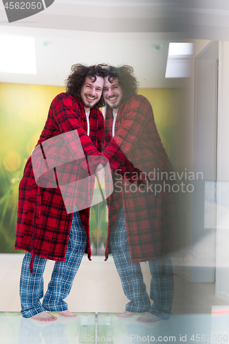 Image of portrait of young man in bathrobe