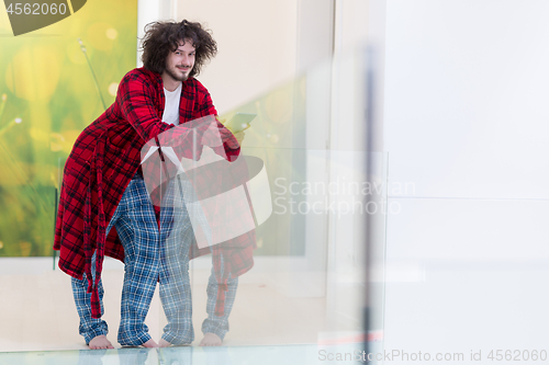 Image of young freelancer using tablet computer