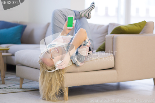 Image of girl enjoying music through headphones