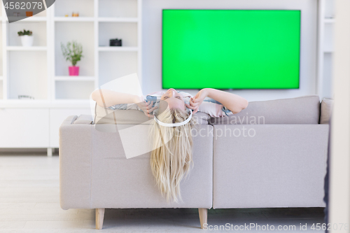 Image of girl enjoying music through headphones