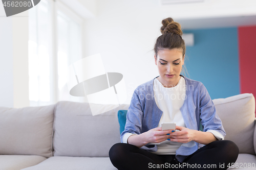 Image of woman using mobile phone