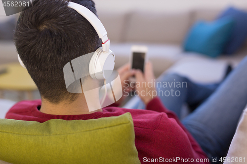 Image of man enjoying music through headphones