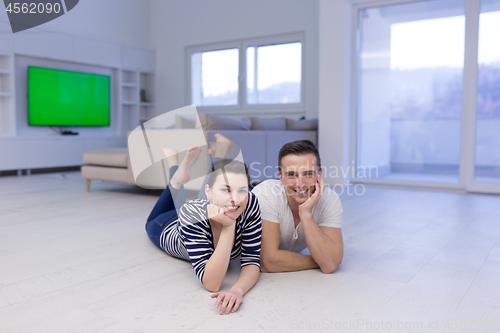 Image of couple lying on the floor at home