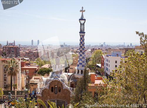 Image of Barcelona, Spain - April 15, 2013: The famous architectural gatehouse at the main entrance to the Park Guell against the sky Barcelona