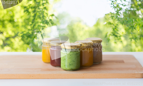 Image of vegetable or fruit puree or baby food in jars