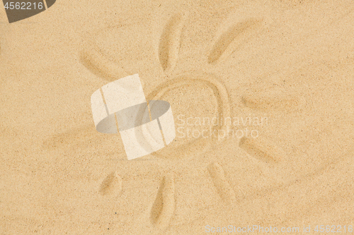 Image of picture of sun in sand on summer beach