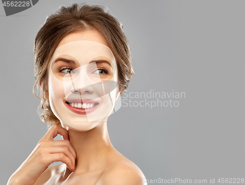 Image of smiling young woman wearing sheet facial mask