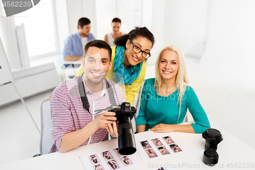 Image of photographers with camera at photo studio