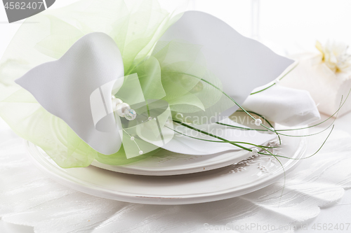 Image of Festive table setting with small gift on plate